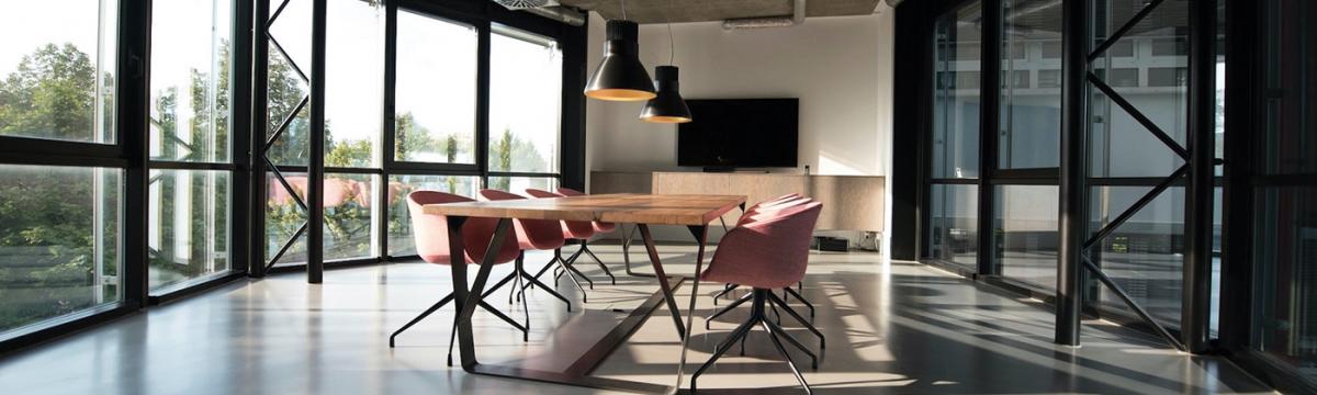 Nastuh Abootalebi via Unsplash View of a board room table with chairs